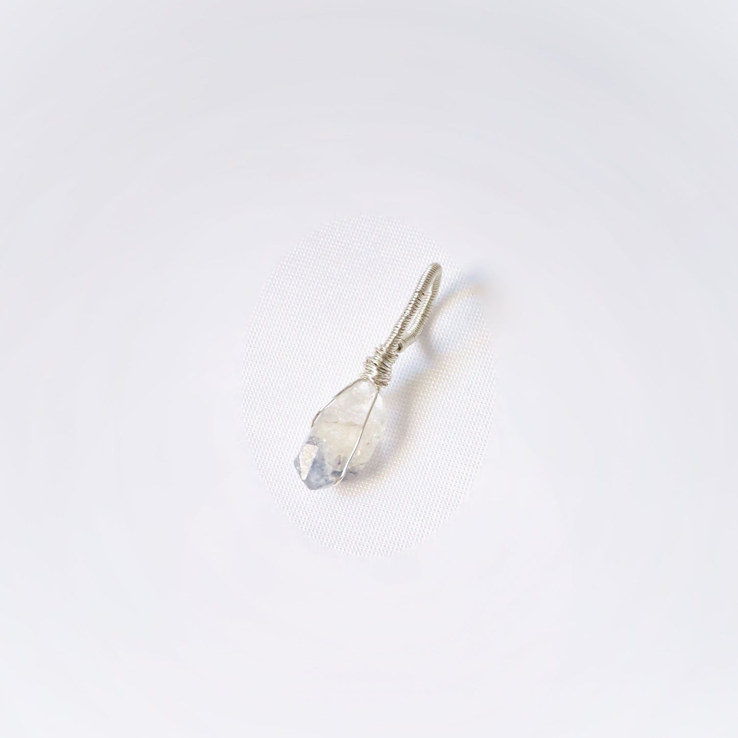 Small crystal pendant on a white background