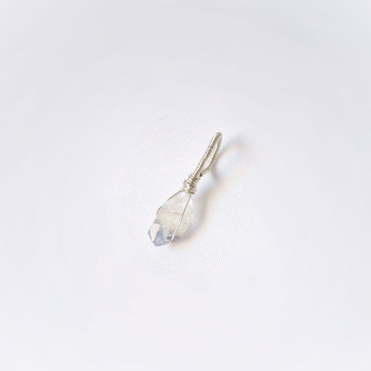Small crystal pendant on a white background